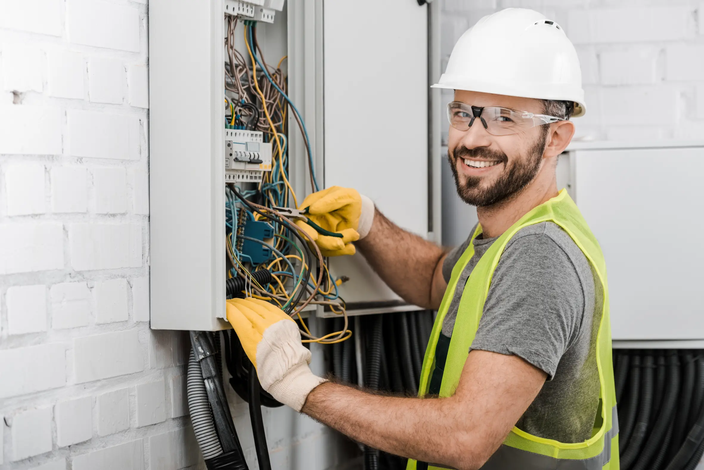 Electrician inspecting and working on a residential electrical panel.
