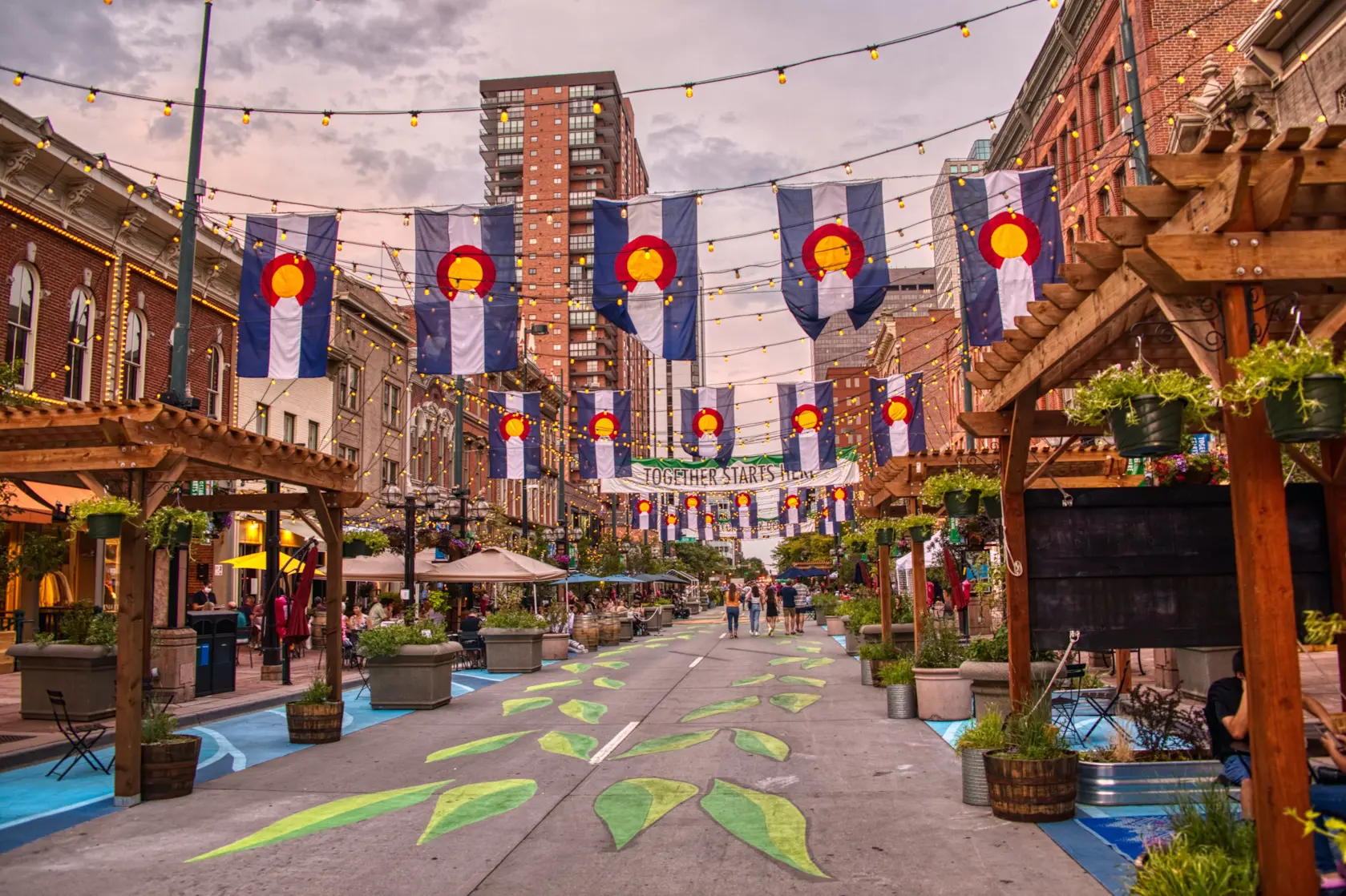 Denver's Larimer Square with Colorado state flags strung across the streets