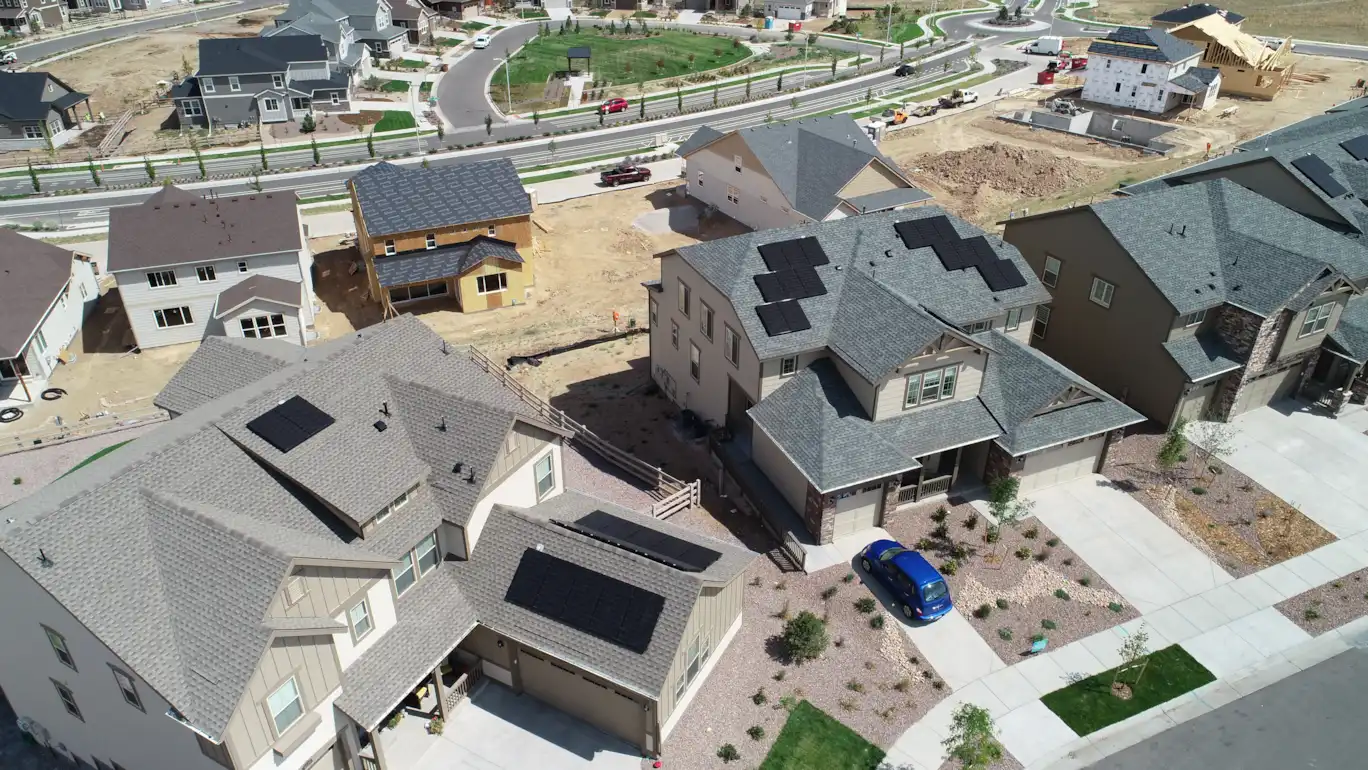 Aerial view of solar panels on homes in a new Denver-area neighborhood
