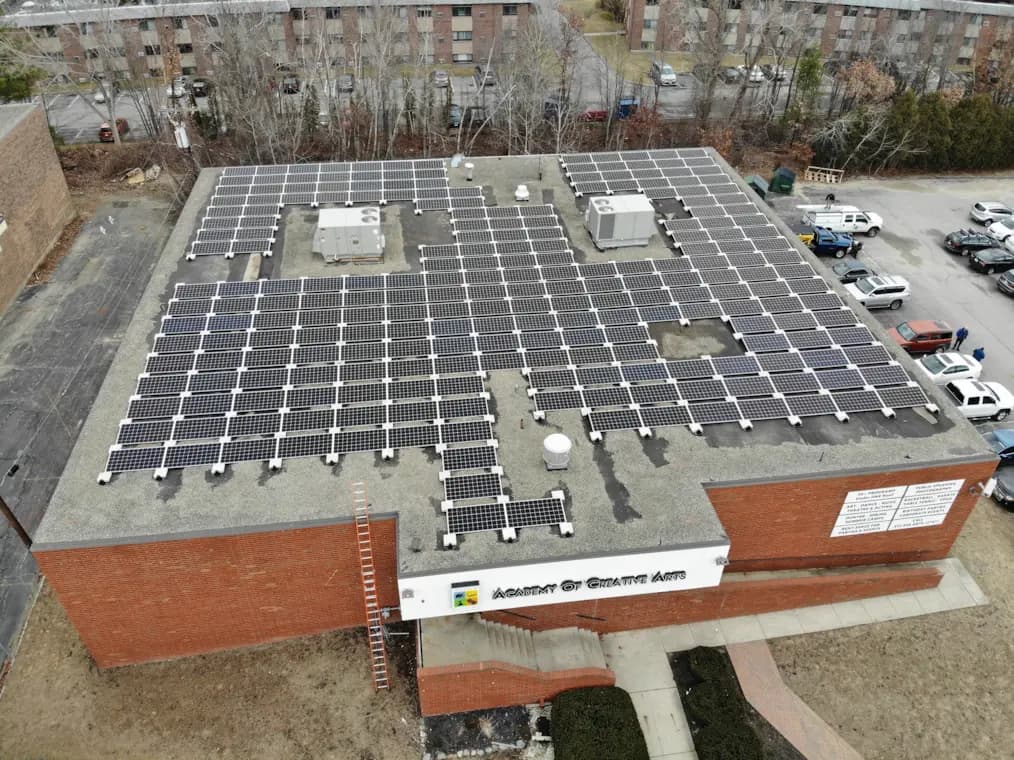 Lunex commercial rooftop solar installation at the Academy of Creative Arts in Burlington, Massachusetts.