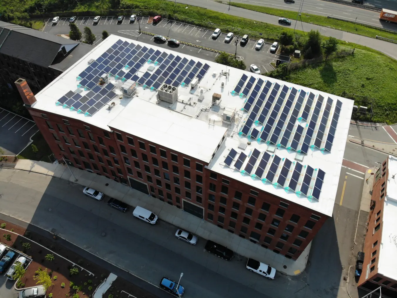 Lunex ballasted rooftop solar array with bifacial modules at Canal District Lofts in Worcester, Massachusetts.